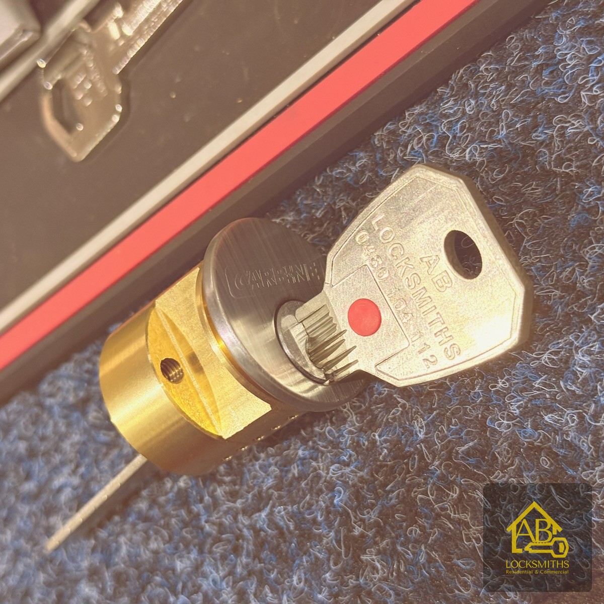 AB Locksmiths branded key